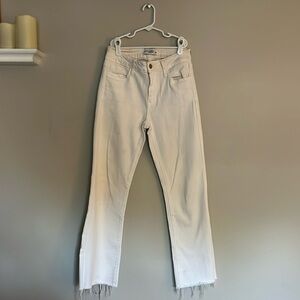 straight leg white jeans with frayed hem at bottom